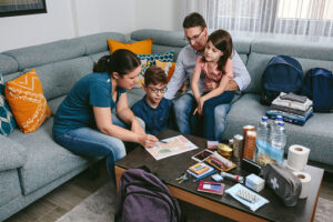 An image of a family setting up their emergency plan for the upcoming disaster.